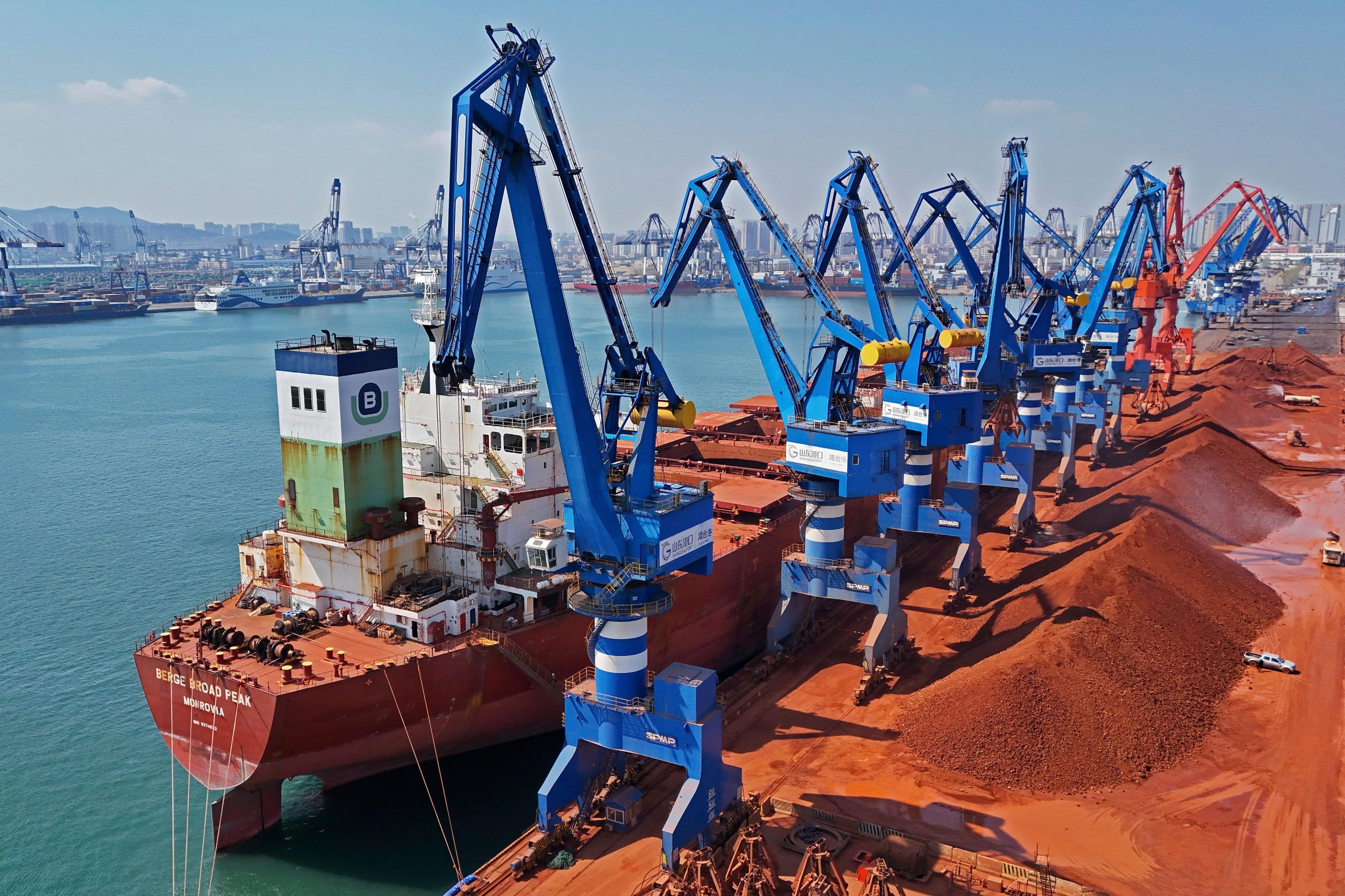 An aerial view of imported iron ore in a port...